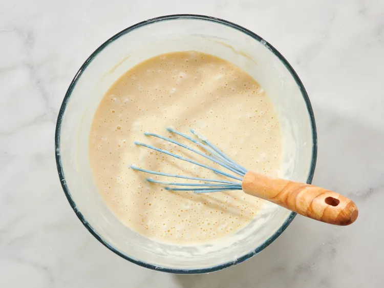 Add the milk, eggs, vanilla extract, and oil, and mix until the batter is smooth