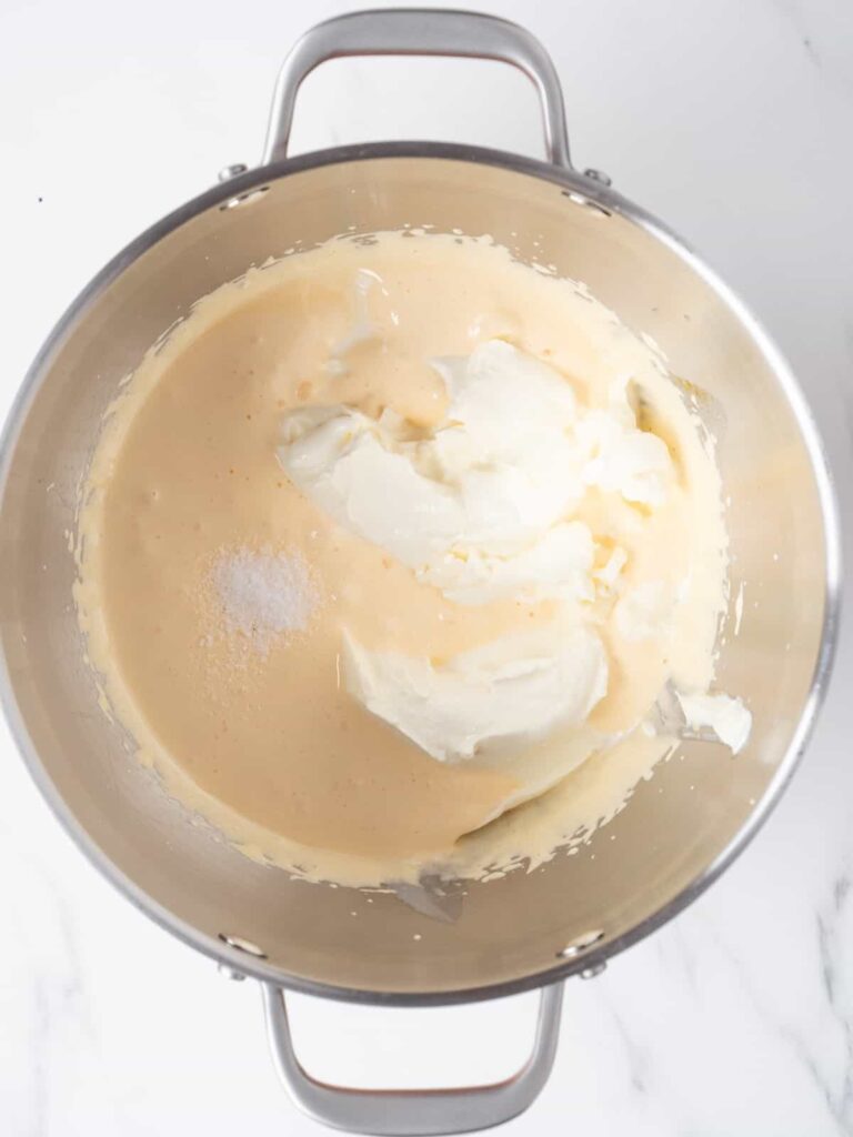 Add the salt and chilled mascarpone cheese, then continue mixing until smooth and creamy.
