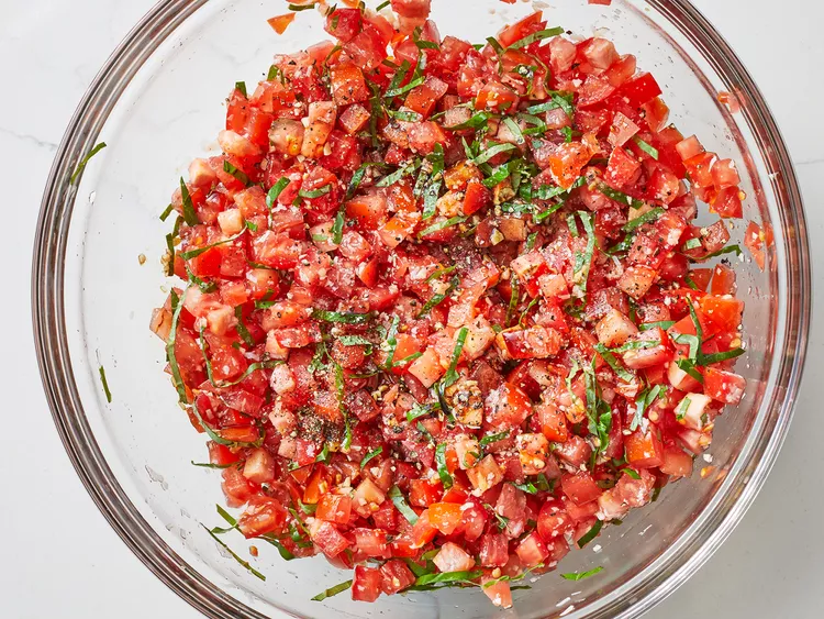 Gently mix everything until the tomatoes are evenly coated and flavorful