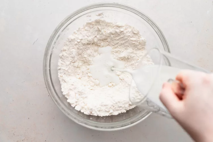 Add the buttermilk and gently stir just until the dough comes together. Add a little more buttermilk if needed