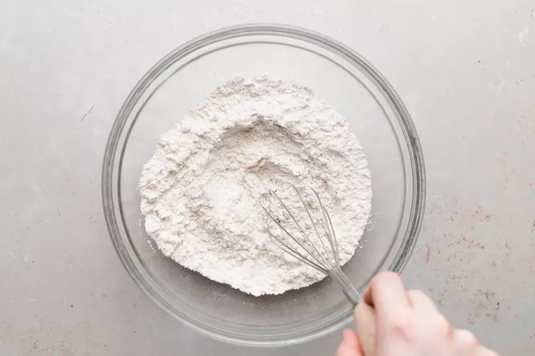 In a bowl, whisk together the flour, sugar