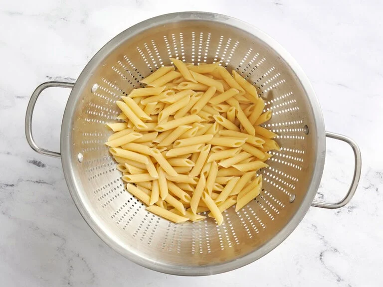 Bring a large pot of salted water to a boil and cook the pasta until al dente. Drain and set aside.