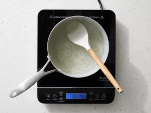 Bring the mixture to a gentle boil, stirring occasionally, until the sugar is completely dissolved.