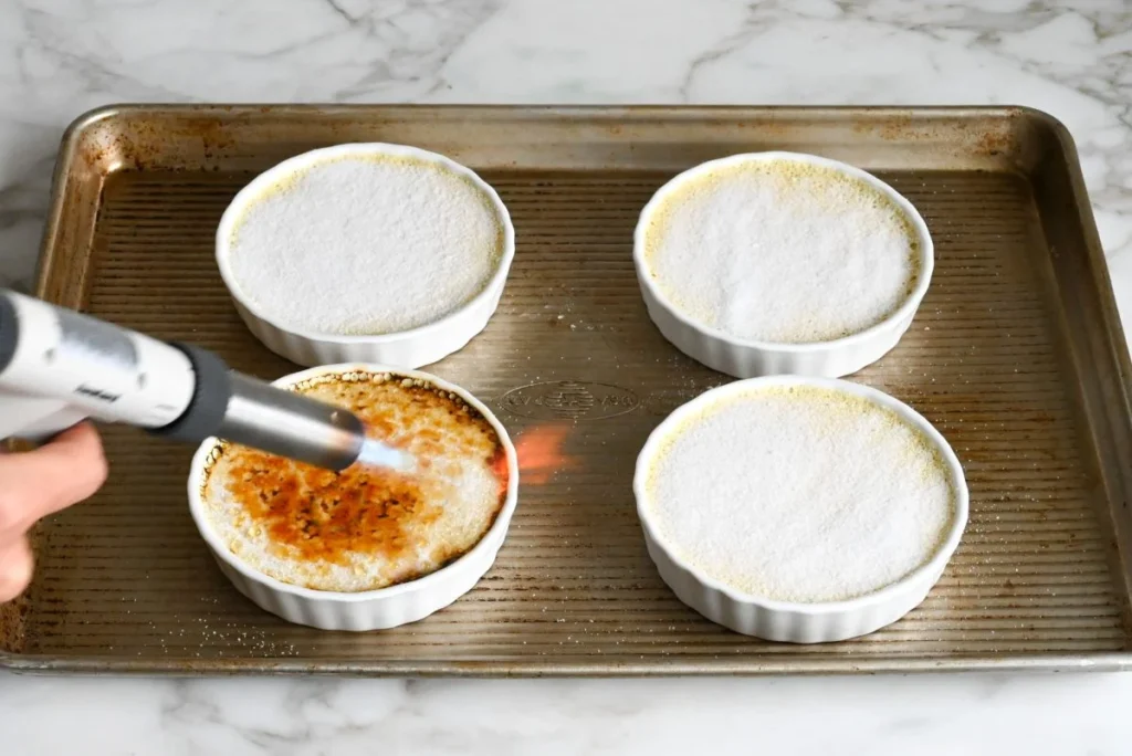 Torch until golden, or broil closely until melted and browned