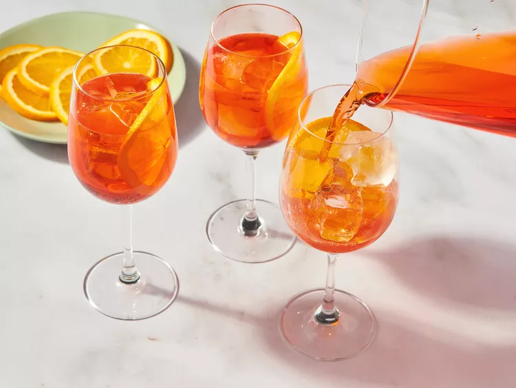 Fill serving glasses with ice and pour the mixture into each glass