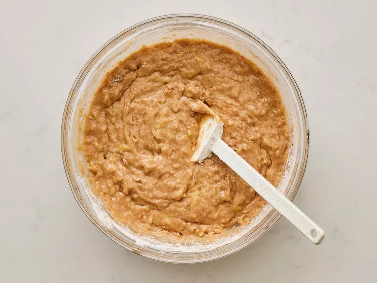 In a separate bowl, mix the flour, cinnamon, baking soda, and salt. Then slowly stir this dry mix into the egg mixture until everything is just combined. Don’t overdo it.