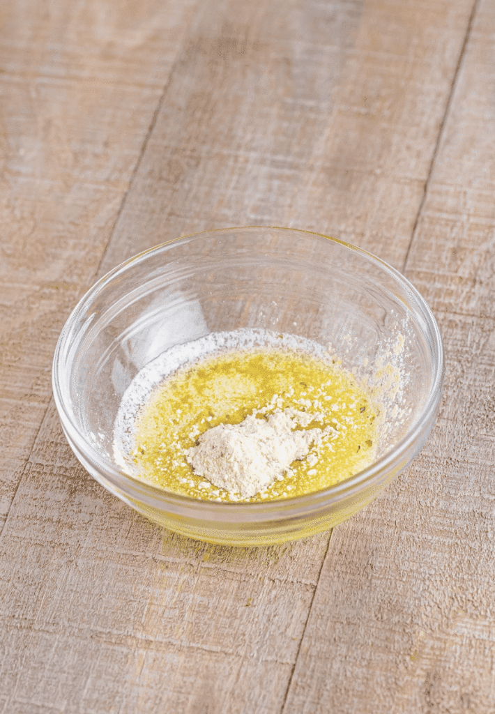 In a small bowl, mix the melted butter with the seasoning packet from the biscuit mix