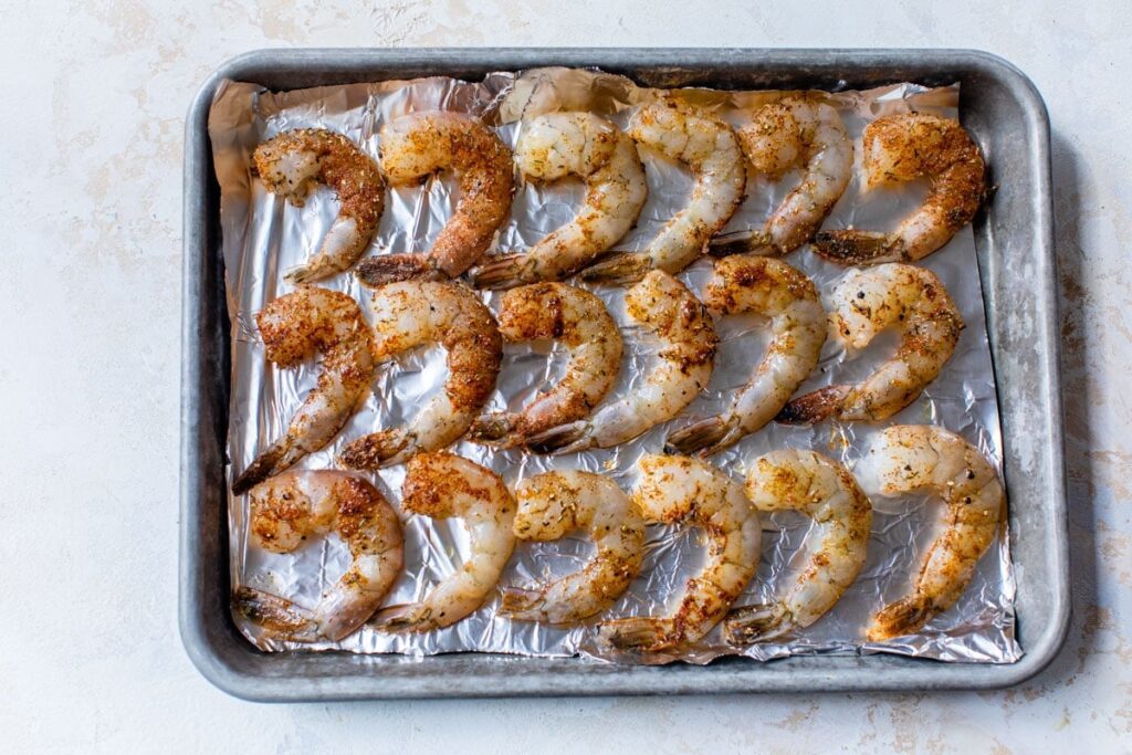 Lay the shrimp in a single layer on a foil-lined baking sheet and roast until pink and cooked through