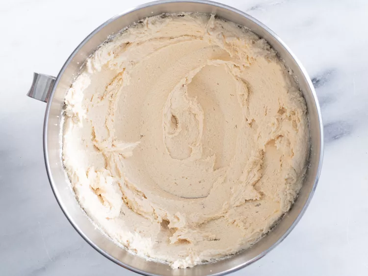 Mix in the eggs and vanilla, beating until the mixture looks fluffy and well combined