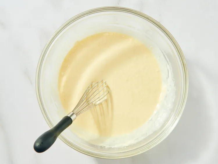 Pour the milk, slightly cooled melted butter, and the egg into that well. Gently mix it all together until it’s mostly combined. SEE: Lumpy Batter is Good Batter, above. Don’t go crazy.