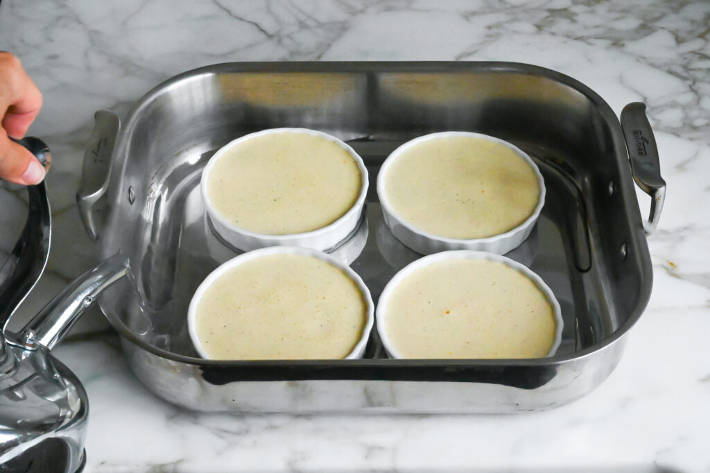 Place ramekins in a roasting pan and divide the custard evenly among them