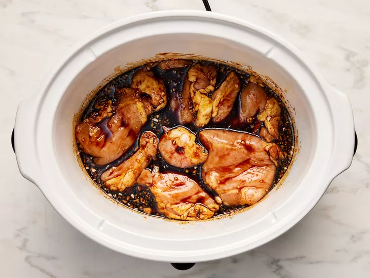 Place the chicken thighs in a single layer into the sauce mixture. Cover