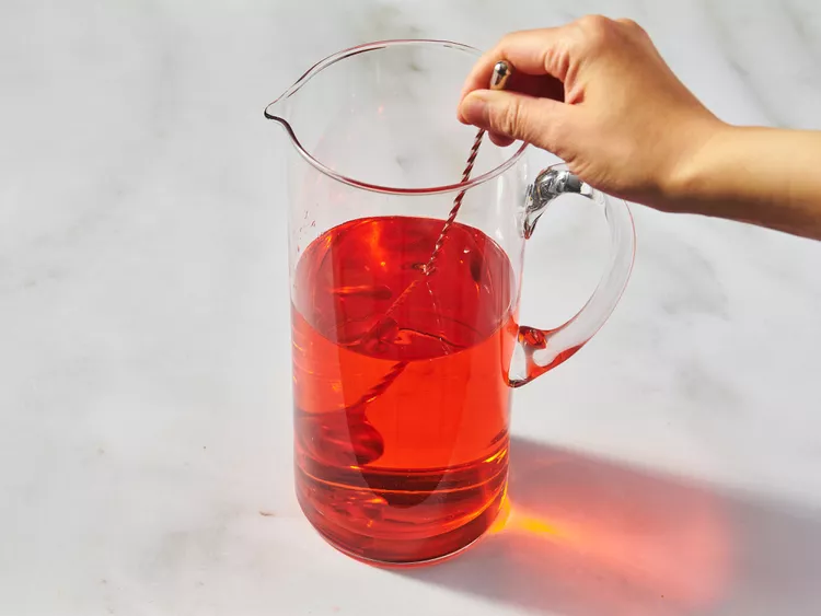 Pour the Prosecco, Aperol, and sparkling water into a large pitcher