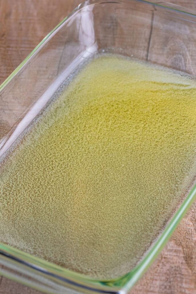 Pour the melted butter into the bottom of a 9×13-inch baking dish, tilting the dish slightly so the butter spreads evenly