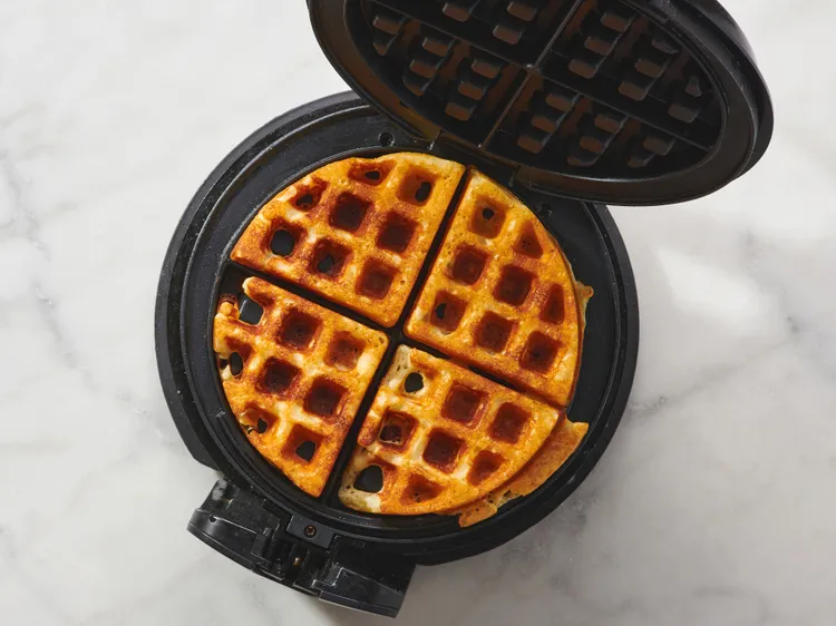Preheat the waffle iron and grease it well. Once hot, pour in the batter and close the lid, and cook until the waffles are golden brown and fragrant