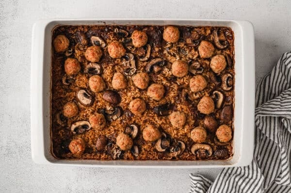 Return the dish to the oven uncovered and bake another 30 minutes, until the rice is tender and the meatballs are heated through and lightly browned.