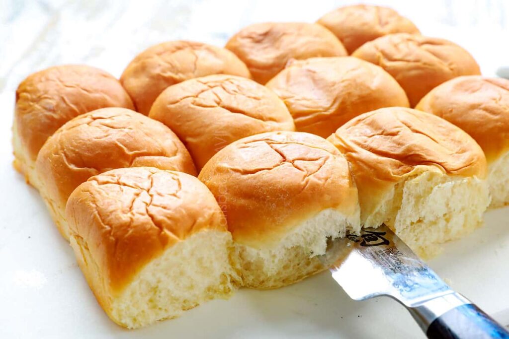 Slice the rolls in half as a whole slab—top and bottom—don’t separate individually.