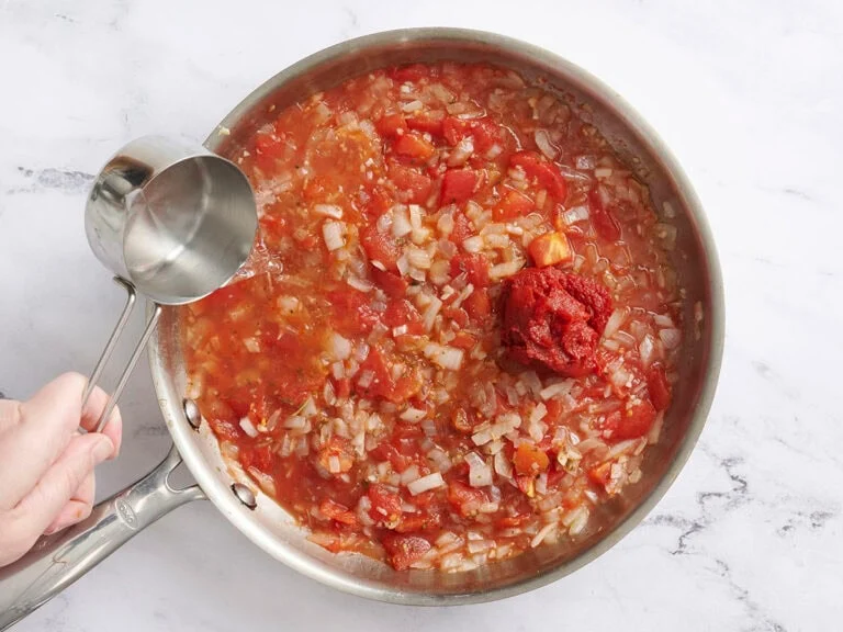 Stir in the tomato paste and water until fully combined.
