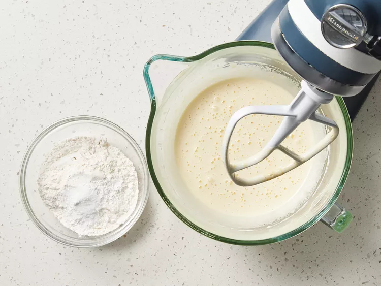 In a bowl, whisk together the flour, baking powder, and salt; set aside