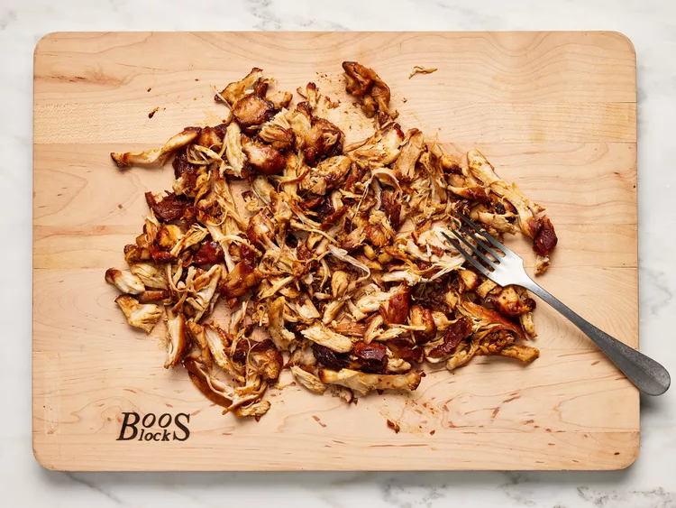 Transfer chicken to a cutting board and shred with a fork.