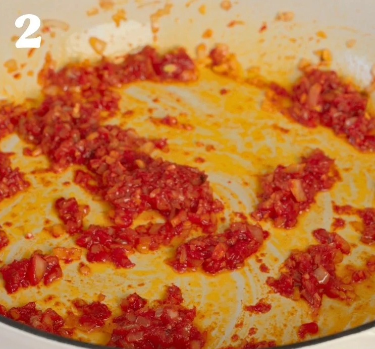 Add the chopped sun-dried tomatoes and tomato paste