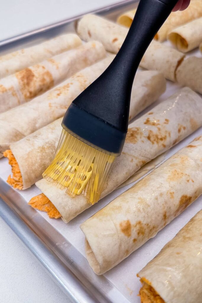 Brush the taquitos lightly with avocado oil on all sides and sprinkle with the remaining ½ teaspoon salt