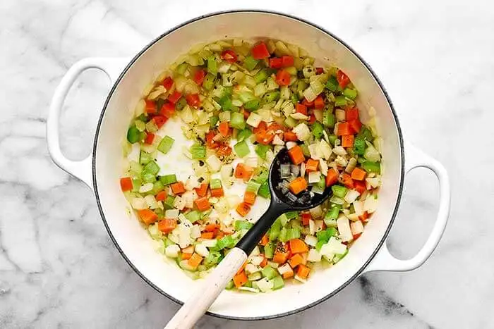 Add the garlic, oregano, basil, and salt. Stir and cook for another minute until fragrant.