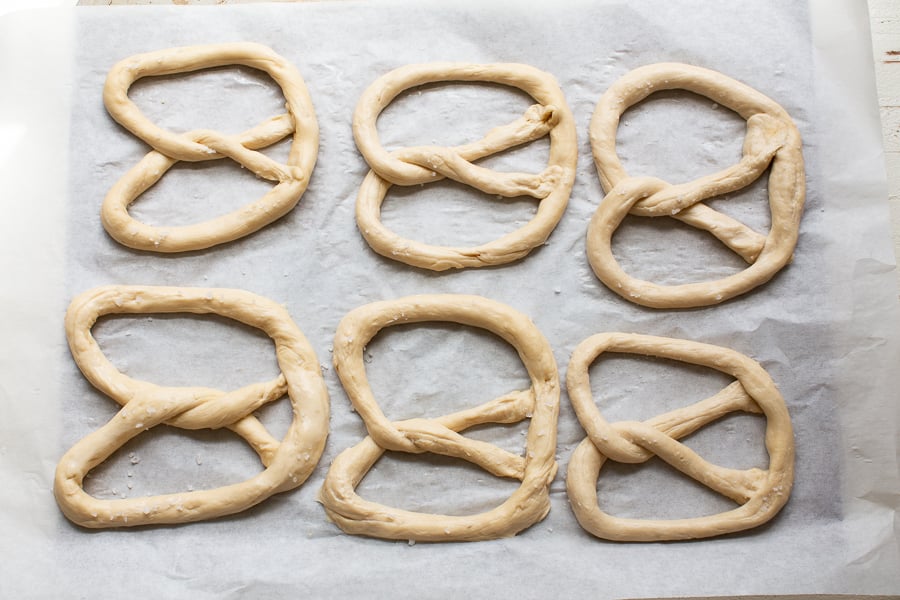 Place on a parchment-lined baking sheet, sprinkle with coarse salt, and bake for 7–8 minutes until golden brown