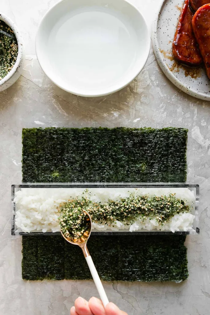 Sprinkle 1–2 tablespoons of furikake over the rice