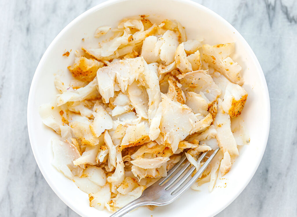 Sprinkle the seasoning mixture evenly over both sides of the fish