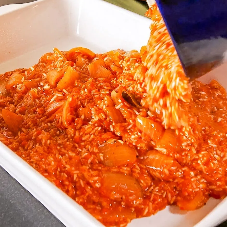 Carefully transfer the mixture to the prepared baking dish.