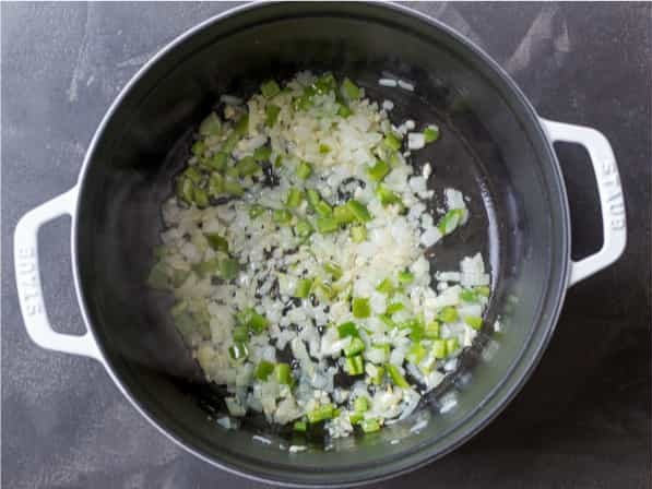 Add the chopped onion, minced garlic, and diced jalapeño, cooking until softened and fragrant