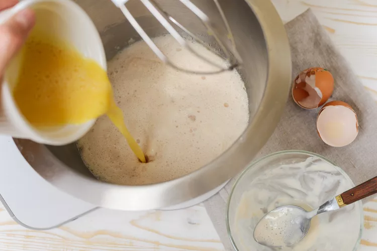 Add the eggs and the activated yeast mixture, stirring until combined