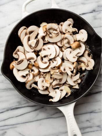 Add the remaining butter and mushrooms to the same skillet, cooking until they are browned and tender