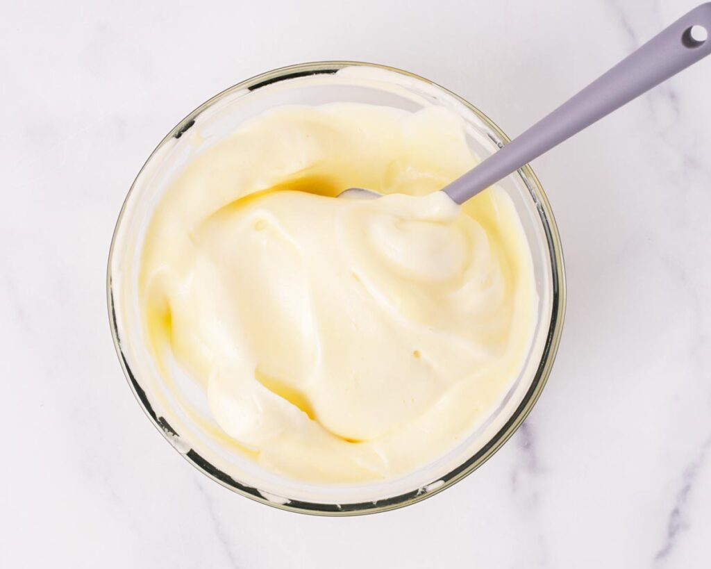 Add the remaining meringue and fold carefully until fully incorporated without deflating the mixture.