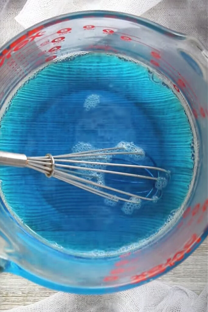 Add the vodka and cold water to the dissolved gelatin mixture and whisk again until fully combined and smooth