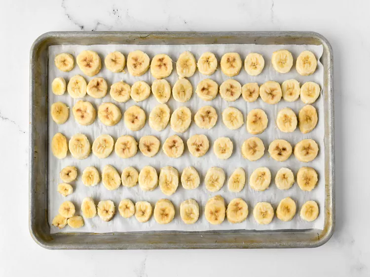 Arrange the banana slices evenly on the sheet so they are not touching each other