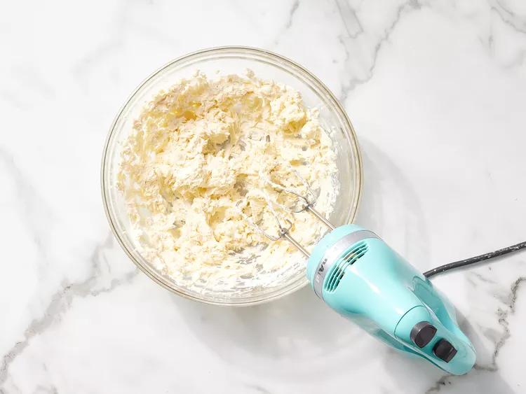 Beat with an electric mixer until the mixture becomes light, smooth, and creamy with no visible lumps