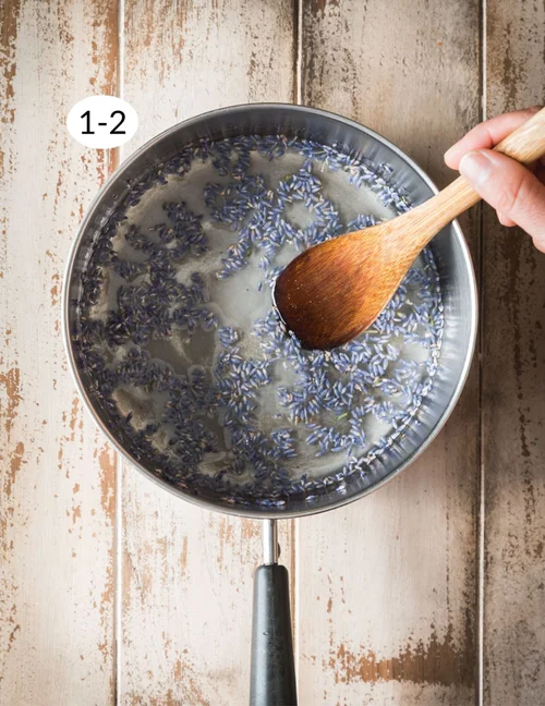 Begin by preparing the lavender simple syrup. Pour the water into a small saucepan over medium-high heat, then add the sugar, a pinch of salt, and the dried lavender buds