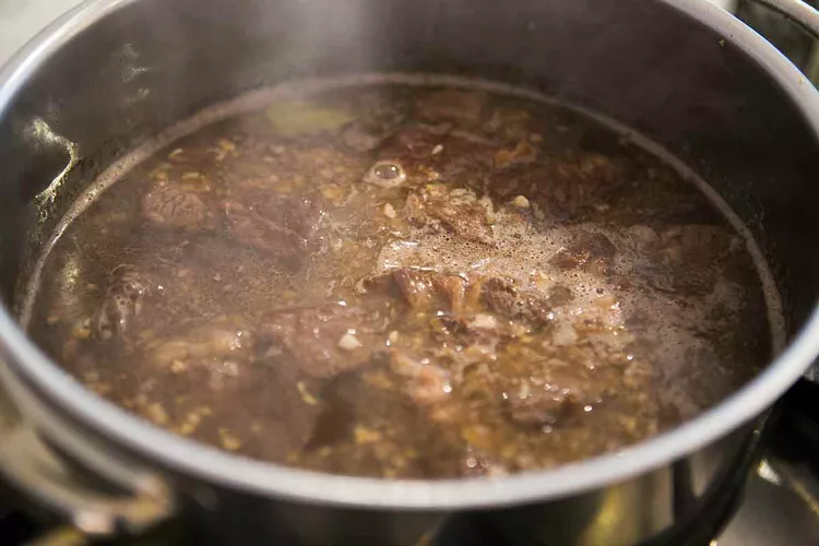 Bring the mixture to a gentle simmer, then reduce the heat to low, cover, and let it cook slowly while stirring occasionally