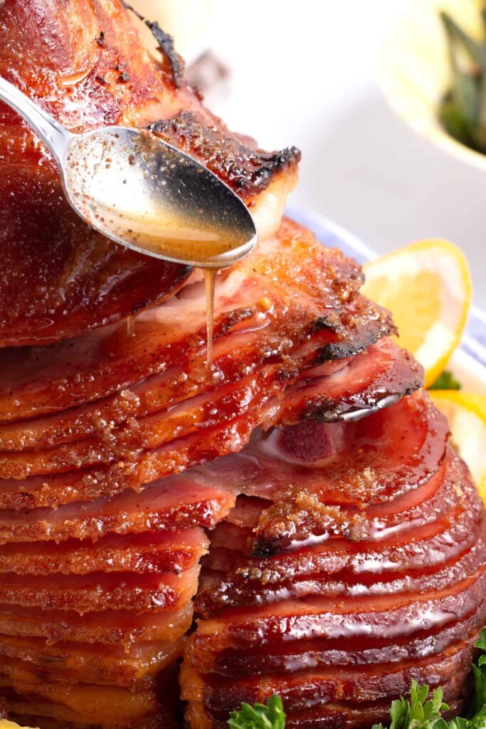 Pour the glaze over the ham, slice, and serve warm