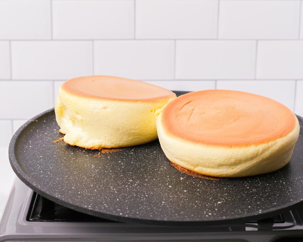 Carefully flip the pancakes, cover again, and continue cooking until golden and fully cooked through