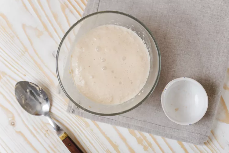 Combine a portion of the warm liquid with the yeast and let it sit until it becomes bubbly and activated
