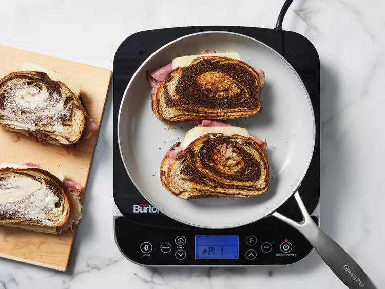 Cook until the bread turns golden brown and crisp, then carefully flip and continue cooking until the second side is equally browned and the cheese has melted