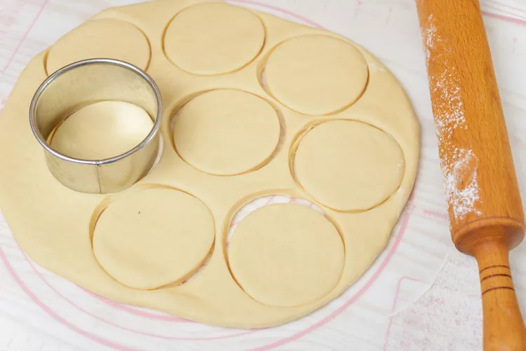 Cut into rounds, brush with butter, and fold each piece in half, lightly pinching the edge