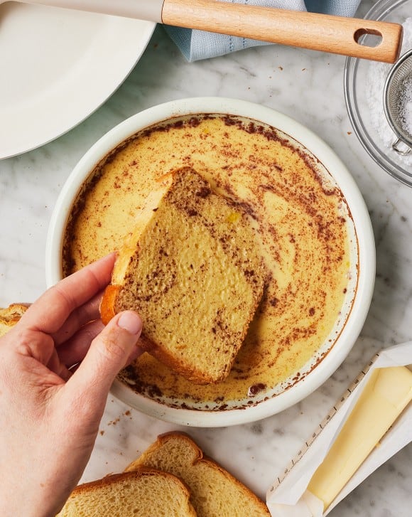 Dip each slice of bread into the egg mixture, turning gently to coat both sides evenly without oversoaking
