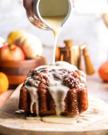 Drizzle the glaze generously over the cooled bread before slicing and serving