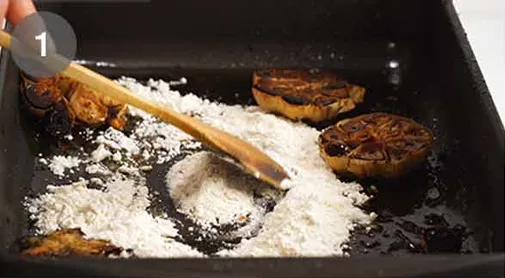 For the gravy, place the roasting pan on the stove over medium heat. Add flour to the drippings and cook briefly