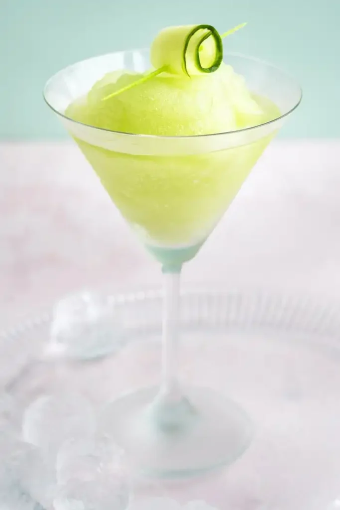 Garnish with thin cucumber ribbons or rosettes threaded onto cocktail sticks and serve immediately