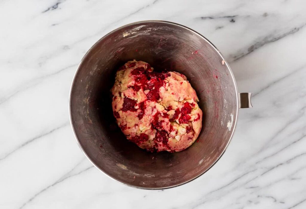 Gently fold in the frozen raspberries. It’s normal if some of them break apart while mixing